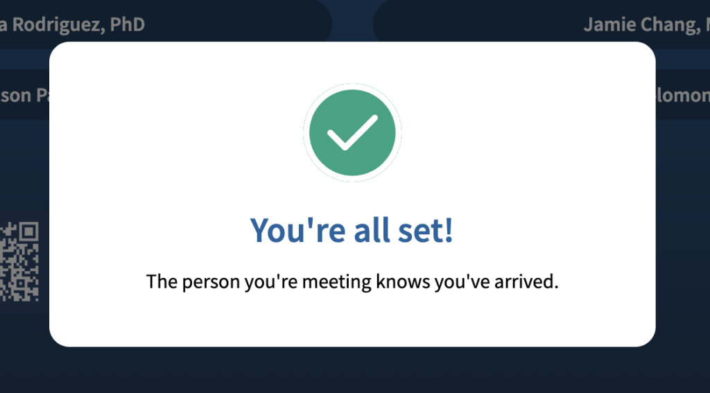 A screenshot which shows a white checkmark on a green background, underneath which is the message, "You're all set! the person you're meeting knows you've arrived."