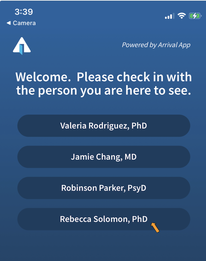 A screenshot of a display on a cell phone. At the top of the screen on the left is the Arrival App logo, which shows an open door. One the top right are the words "Powered by Arrival App".
Beneath that is a message saying "Welcome. Please check in with the person you are here to see." It lists four names of people, and there is an orange arrow pointing to one of the names.
